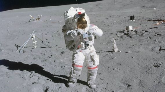 An astronaut in a space suit walking on the Moon
